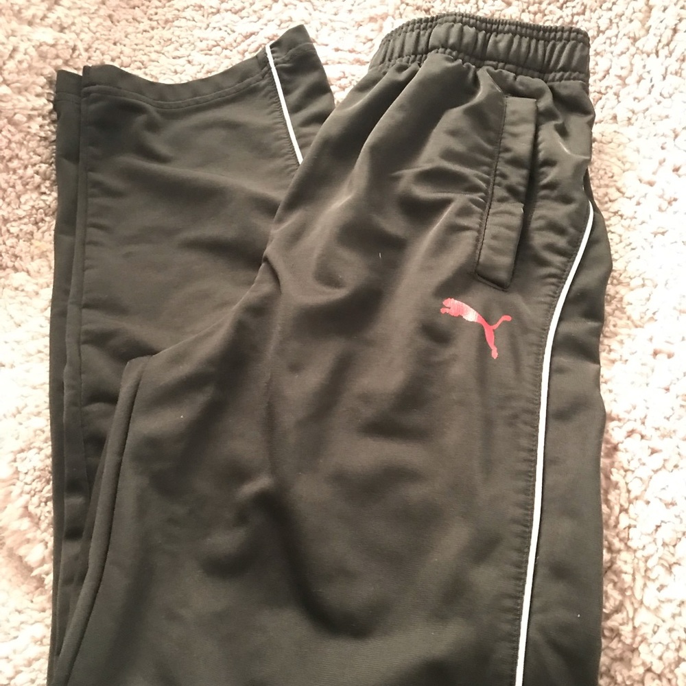 Black Puma track pants.
